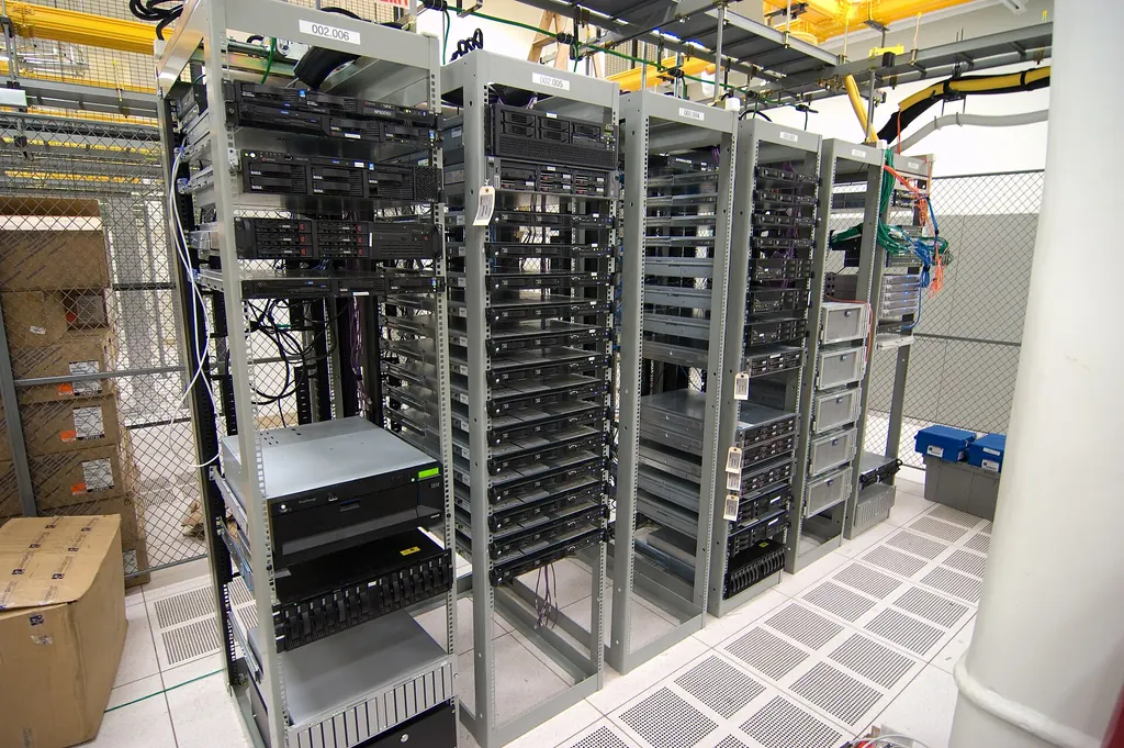 Rows of open server racks holding rack-mounted servers in a data centre