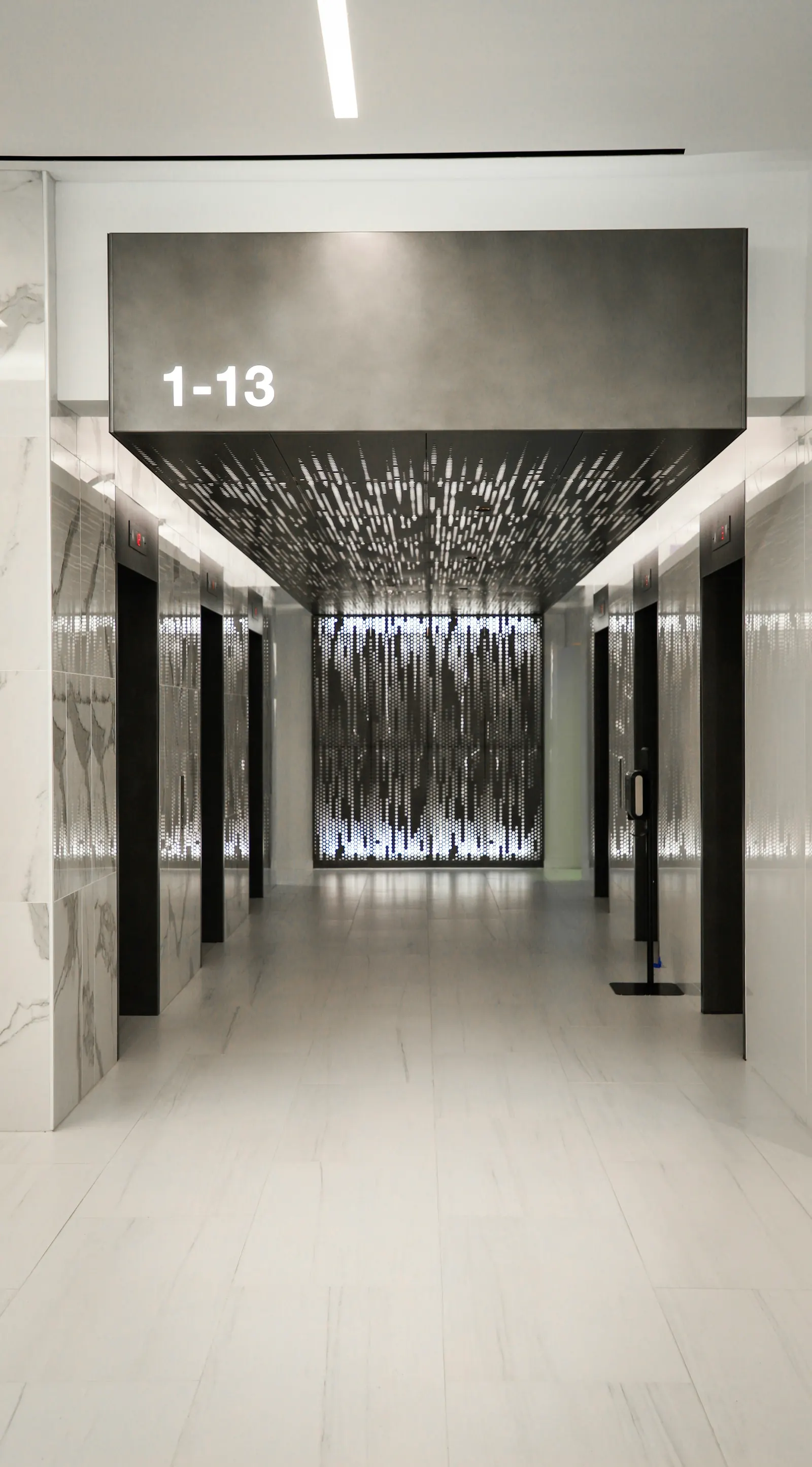A lift lobby with doors on both sides