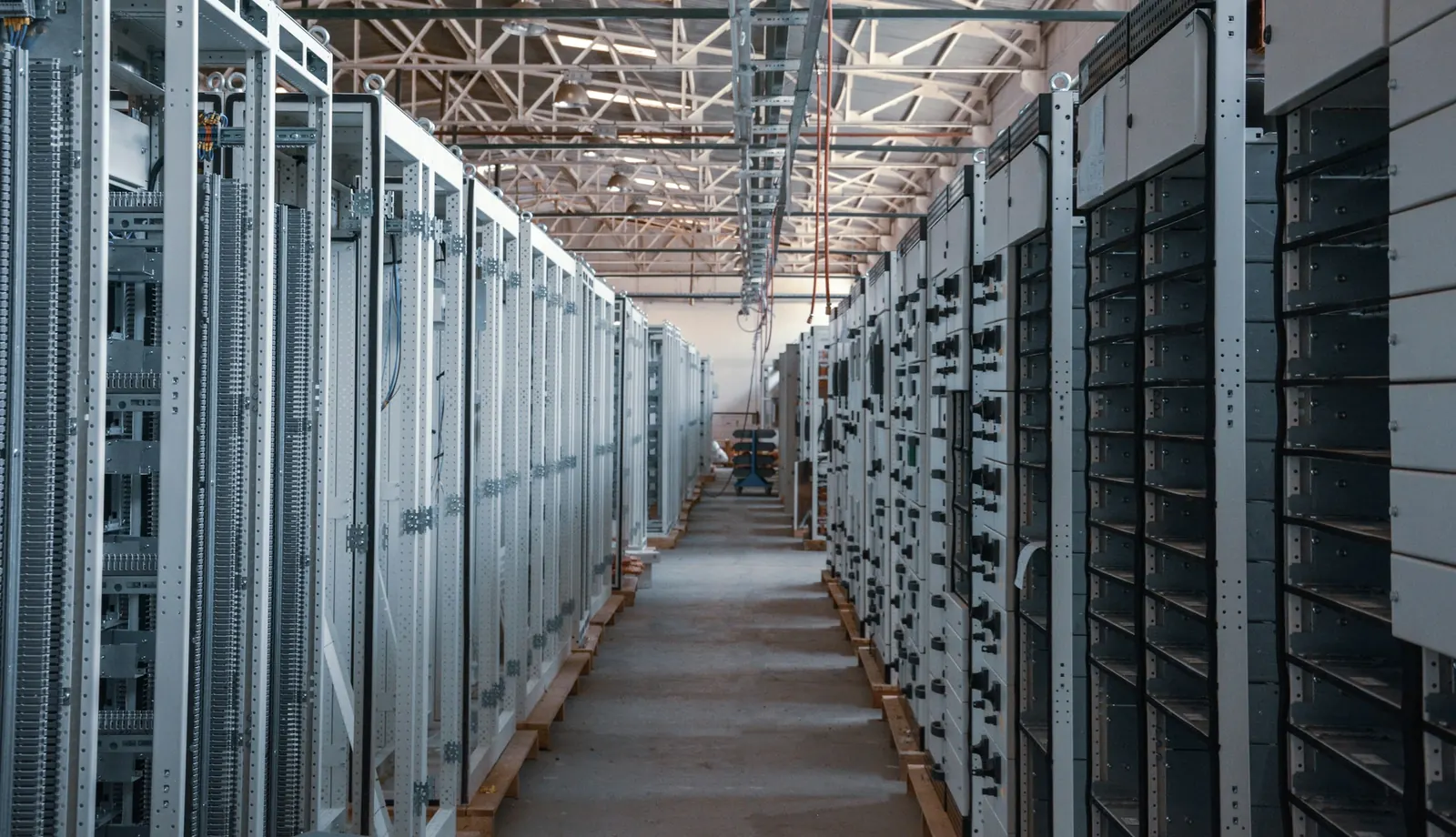 An aisle between rows of server racks